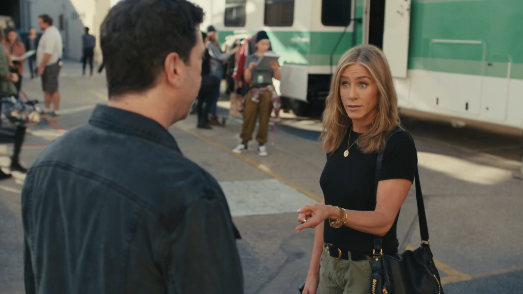 Jennifer Aniston points during an UberEats commercial for the Superbowl in 2024.