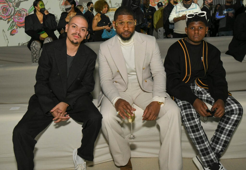 Evan Ross, Usher, and Naviyd Ely Raymond sit together in 2002.