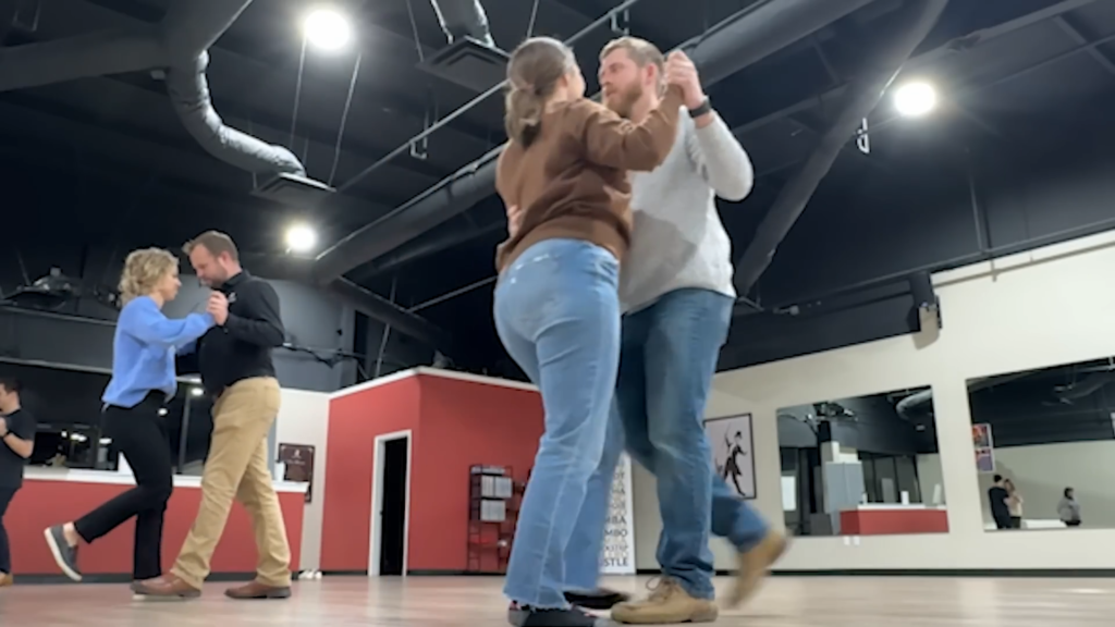 Joy-Anna Duggar wears pants and dances with husband Austin Forsyth.