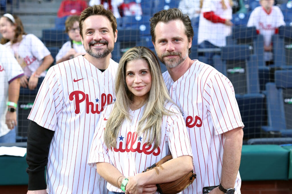 Will Friedle, Danielle Fishel and Rider Strong pose for a photo during a game between the Philadelphia Phillies and the Pittsburgh Pirates at Citizens Bank Park on September 27, 2023 in Philadelphia, Pennsylvania.