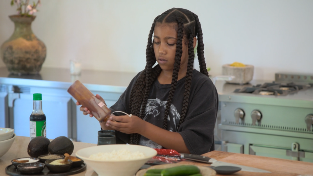 North West prepares food in her mother's spacious, hauntingly minimalist kitchen.