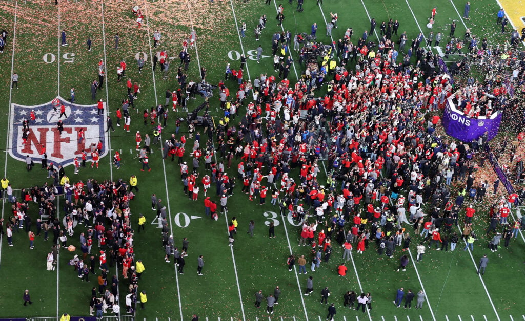 A crowd on the field during the 2024 Super Bowl.