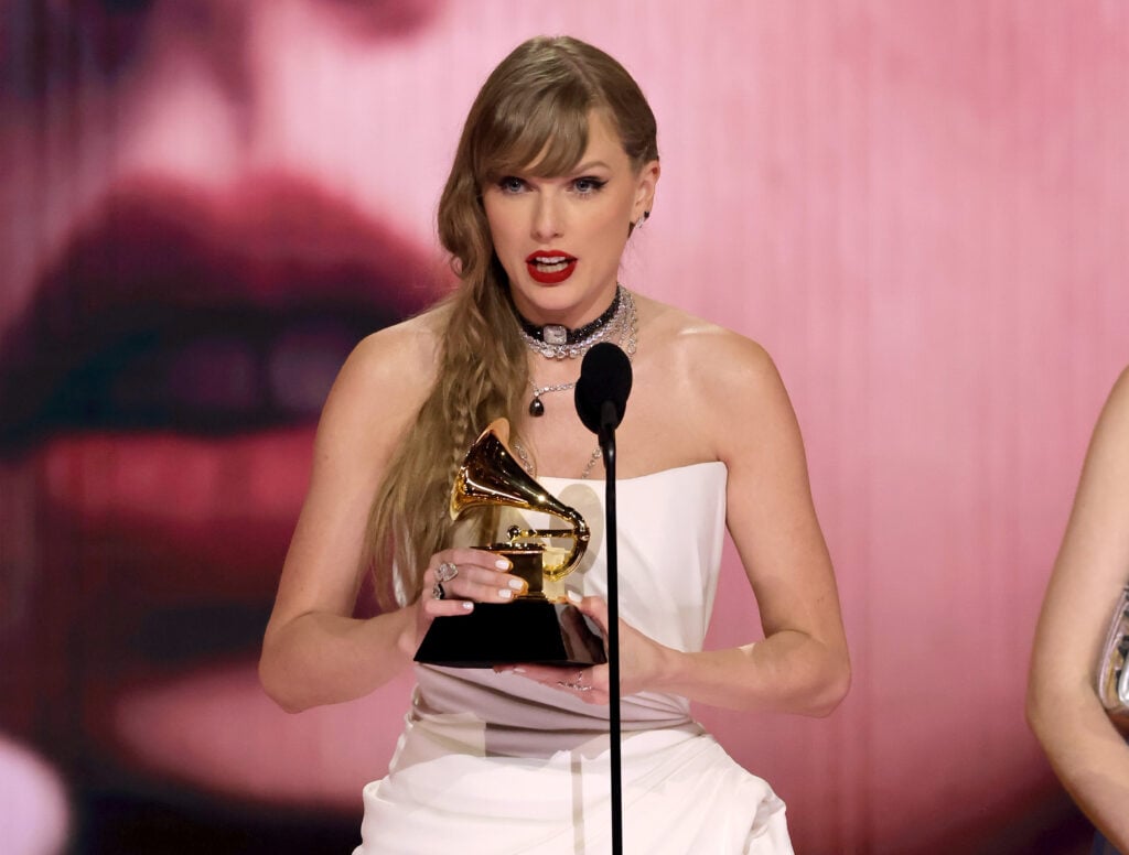 Taylor Swift accepts her Grammy Award in 2024.