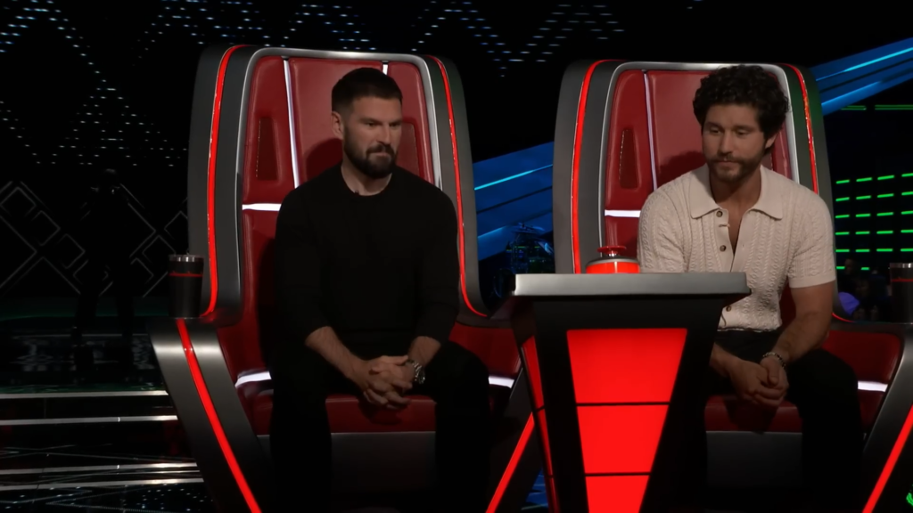 Country duo Dan + Shay listen on The Voice Season 25.