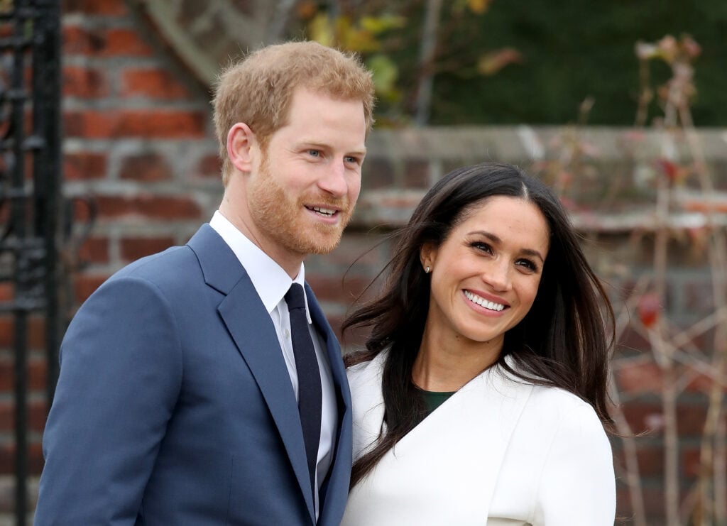 Meghan Markle and Prince Harry greet reporters in London.