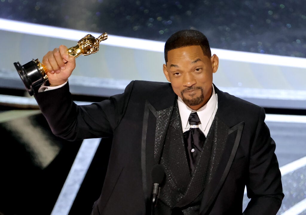 Will Smith receives an Academy Award at the Oscars in 2022.