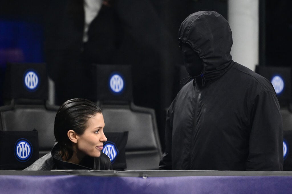 Kanye West and Bianca Censori in February of 2024 at a sports game.