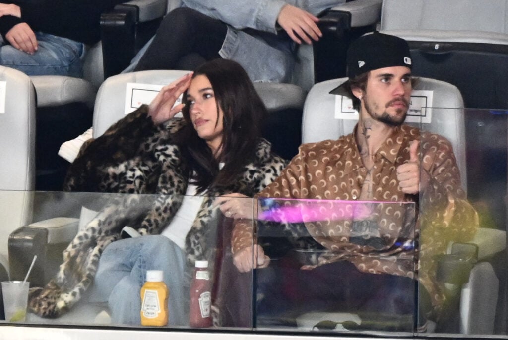 Justin Bieber and his wife US model Hailey Bieber watch Super Bowl LVIII between the Kansas City Chiefs and the San Francisco 49ers at Allegiant Stadium in Las Vegas, Nevada, February 11, 2024. 