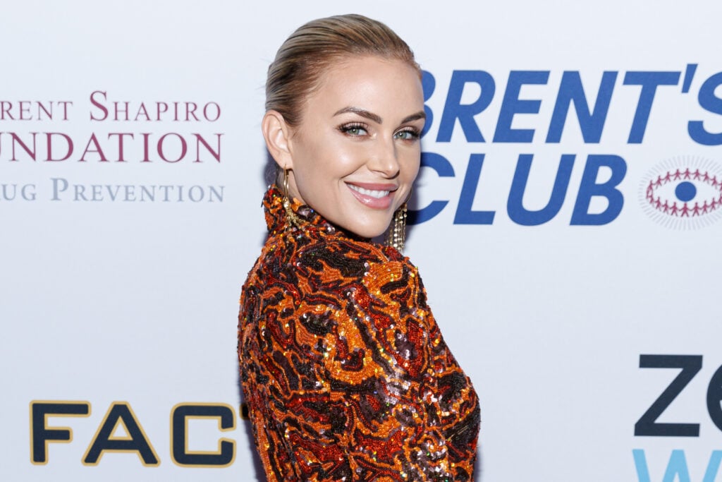 Lala Kent smiles on a red carpet