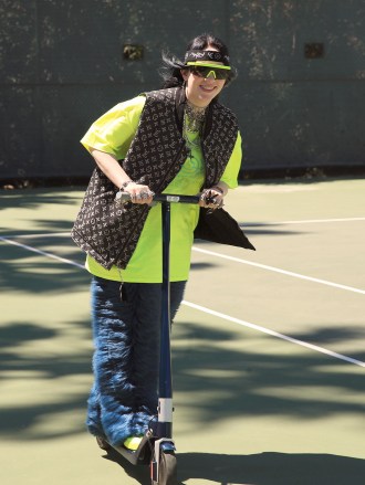 Billie Eilish rides a scooter on the tennis court at the 5th annual Interscope Coachella party.
The 5th Annual Interscope Coachella Party, Coachella Valley Music and Arts Festival, Weekend 1, Day 2, Palm Springs, USA - 13 Apr 2019