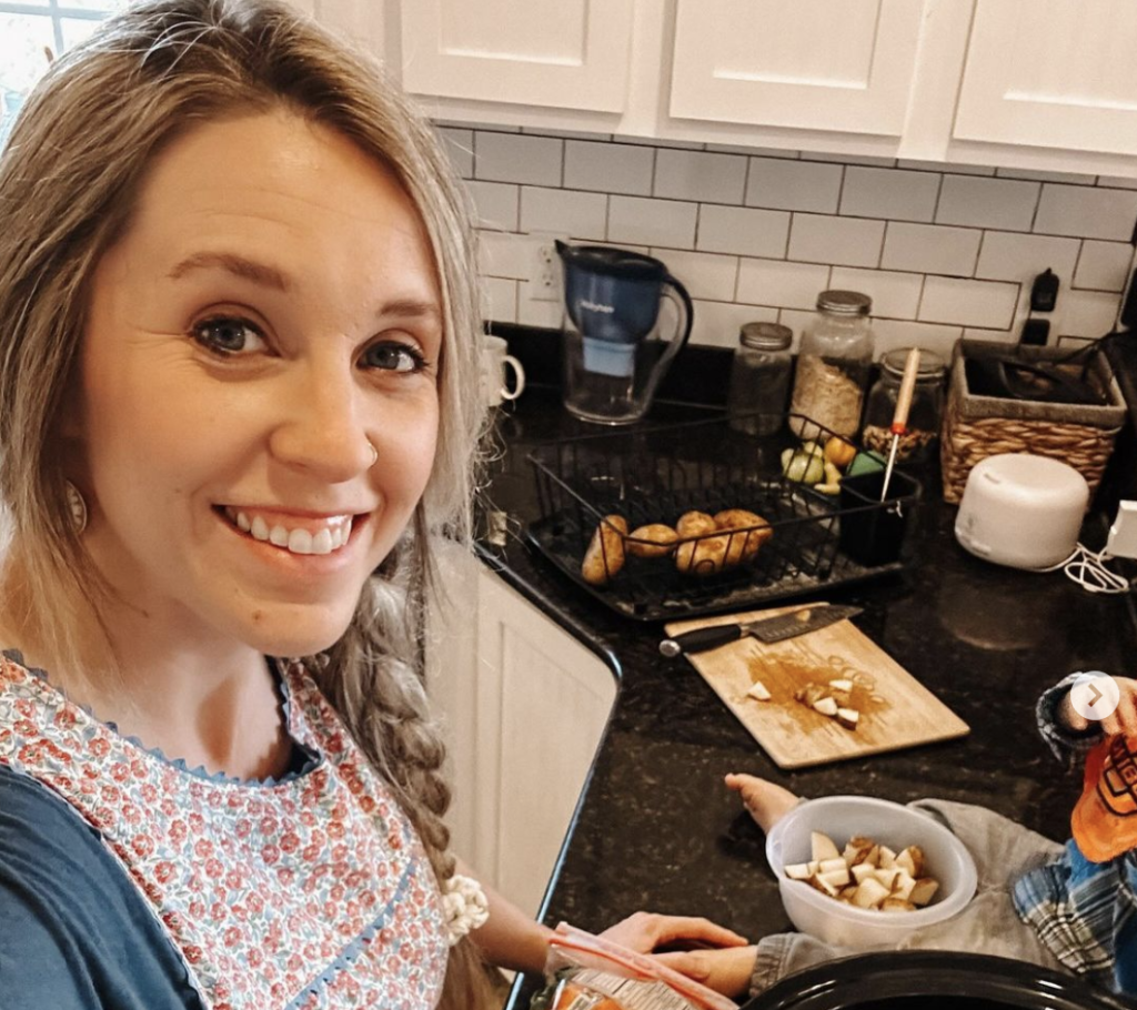 Jill Duggar poses for a selfie while cooking at home.