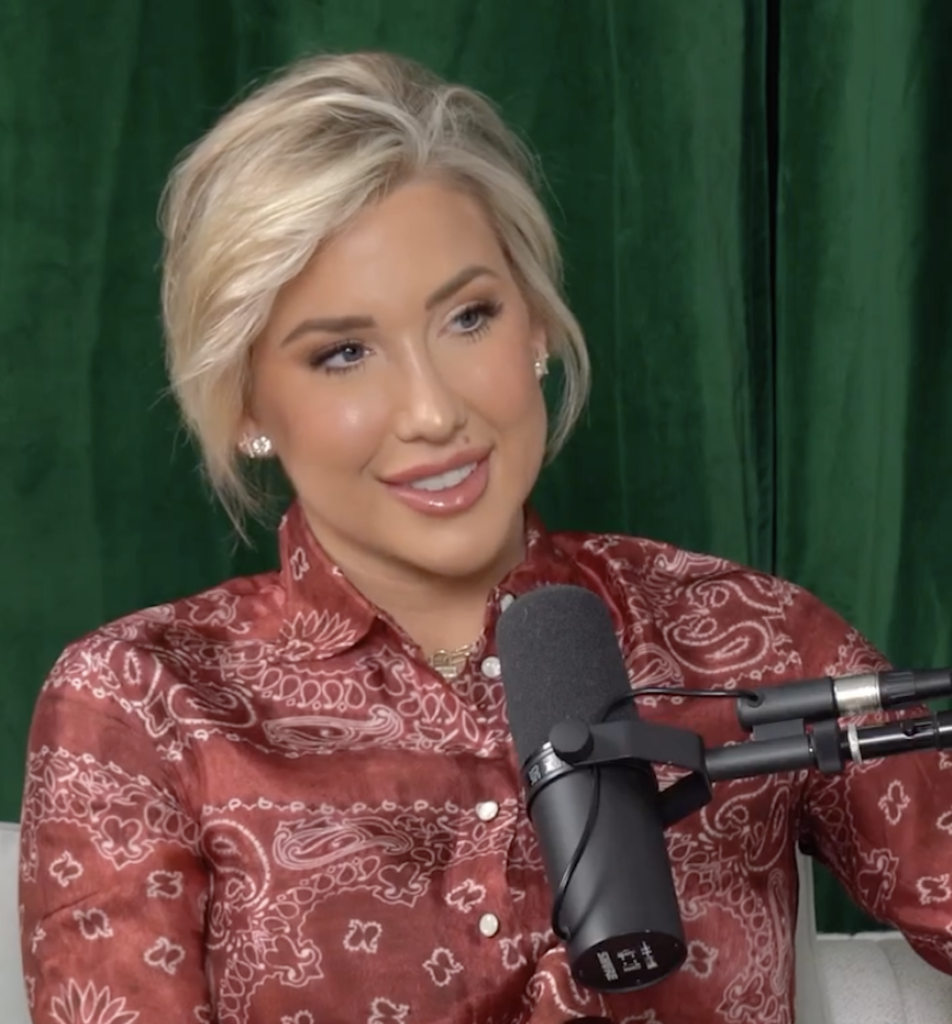 Savannah Chrisley speaks on a podcast.